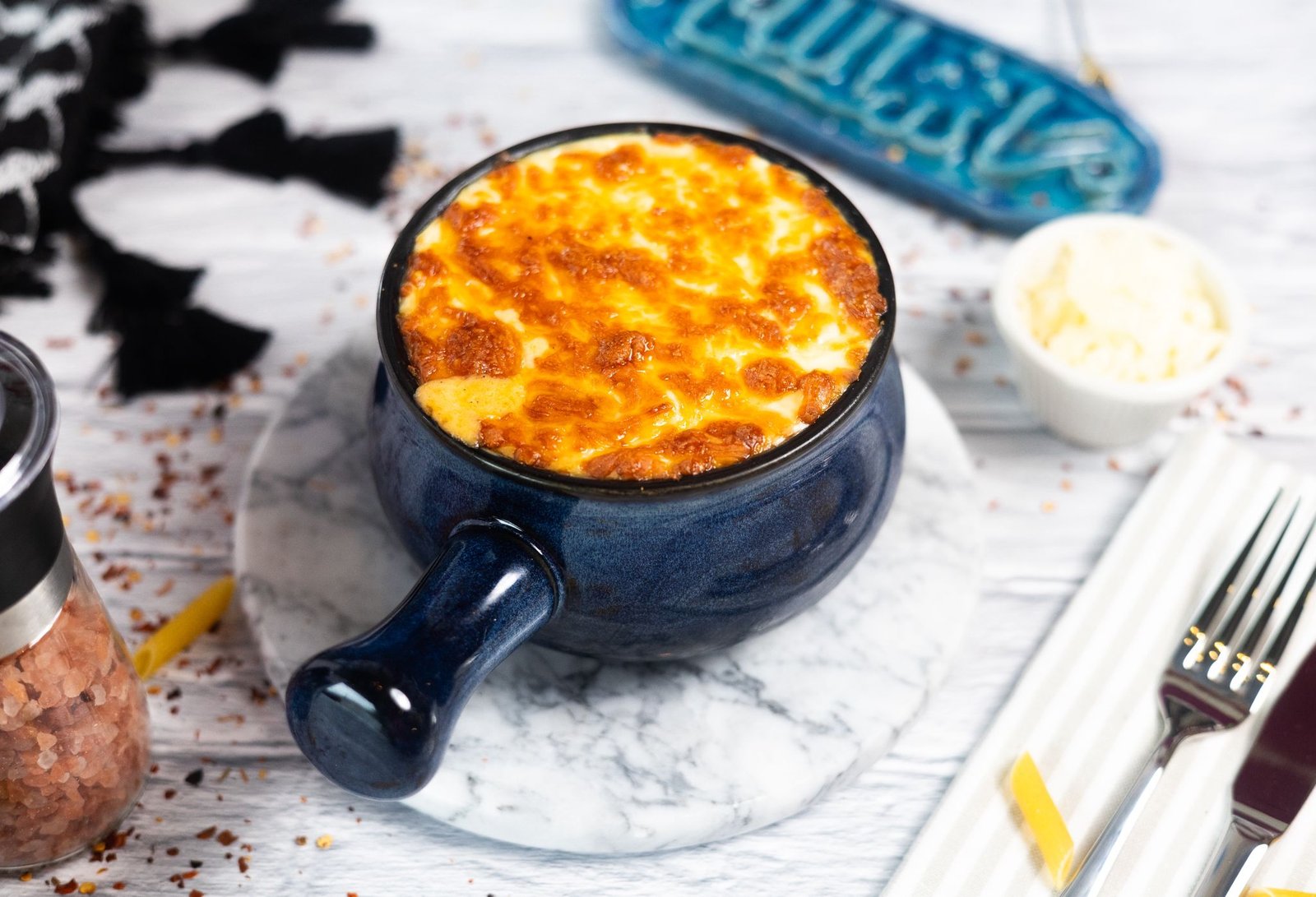 Baked macaroni bechamel with golden melted cheese