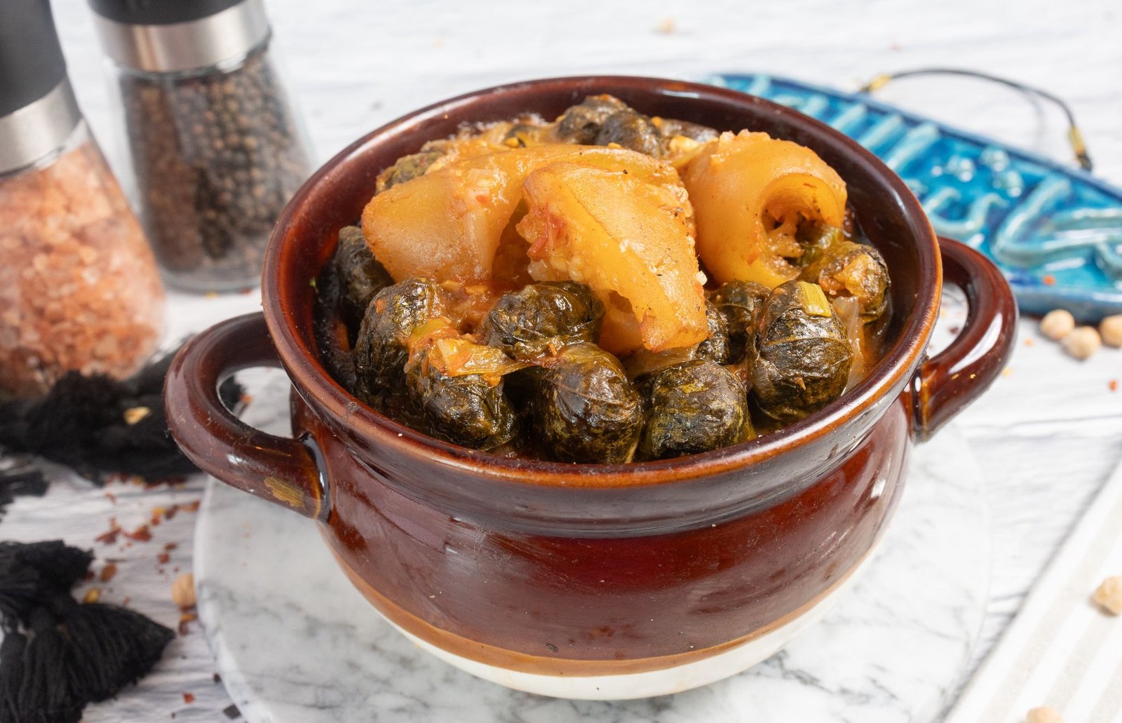 Mahshi stuffed vine leaves and vegetables in a clay pot