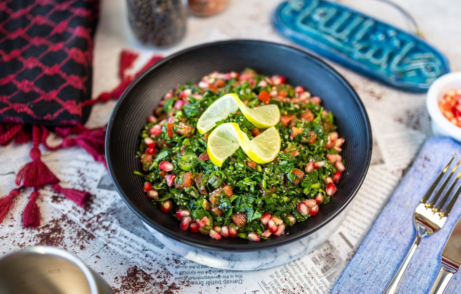 Tabouleh Syrian style with pomegranate seeds and lemon